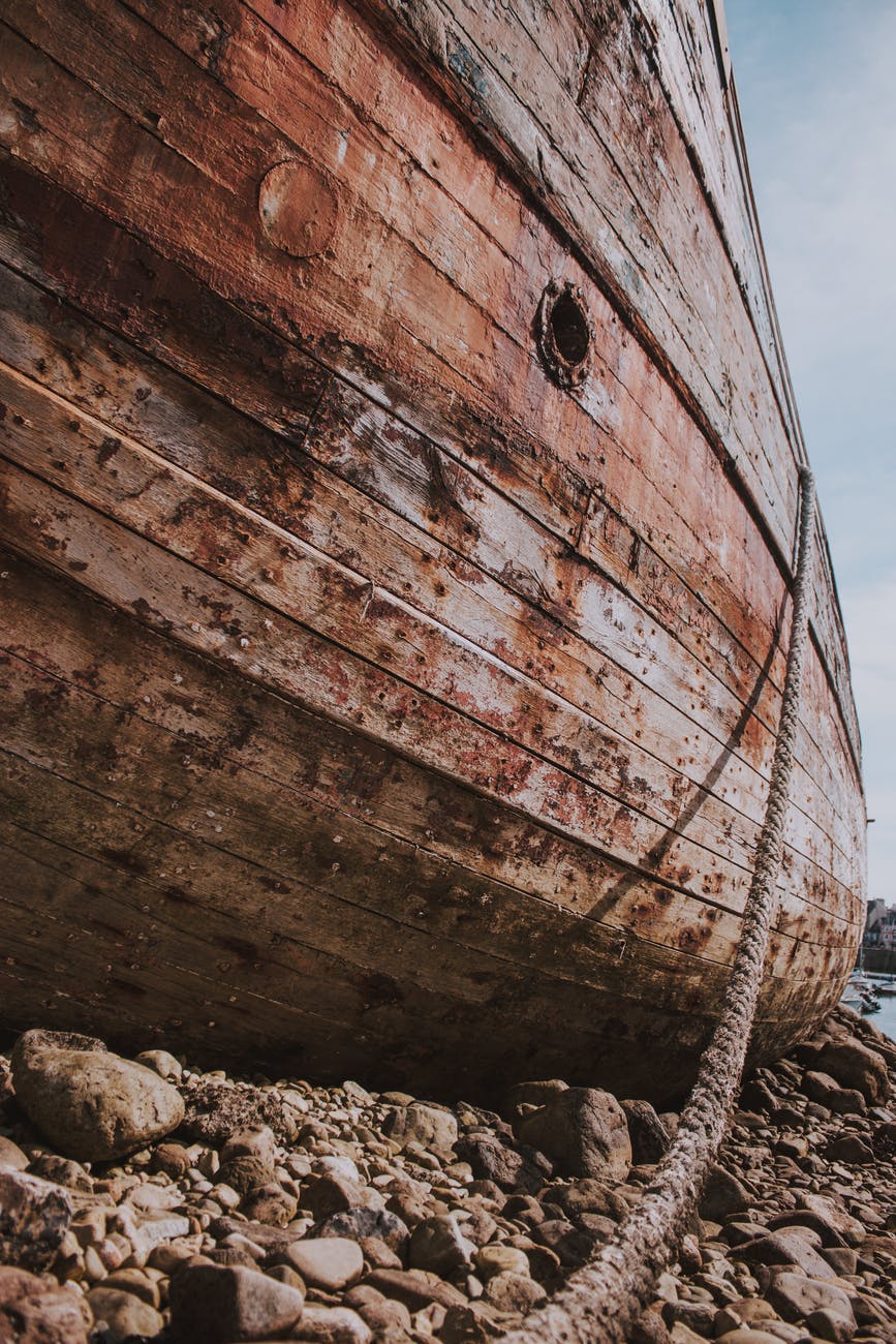 old ship on stony beach